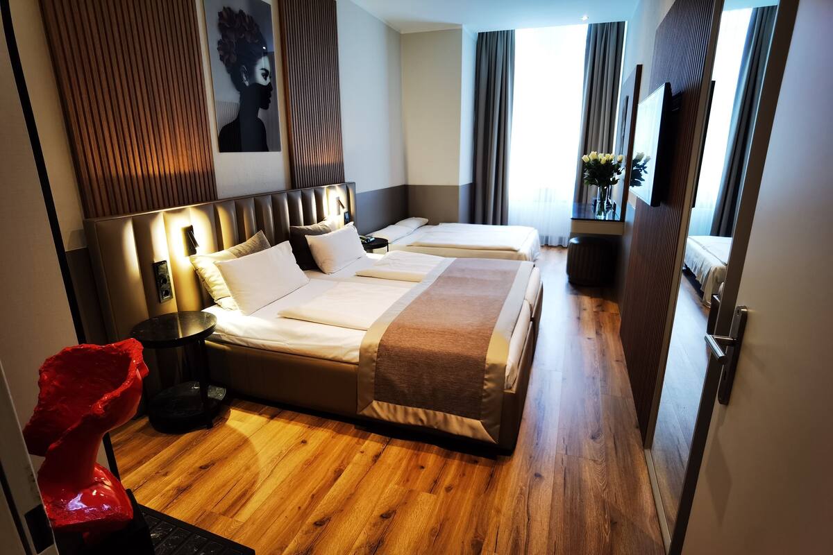 Standard Quadruple Room | Hypo-allergenic bedding available, minibar, in-room safe, desk