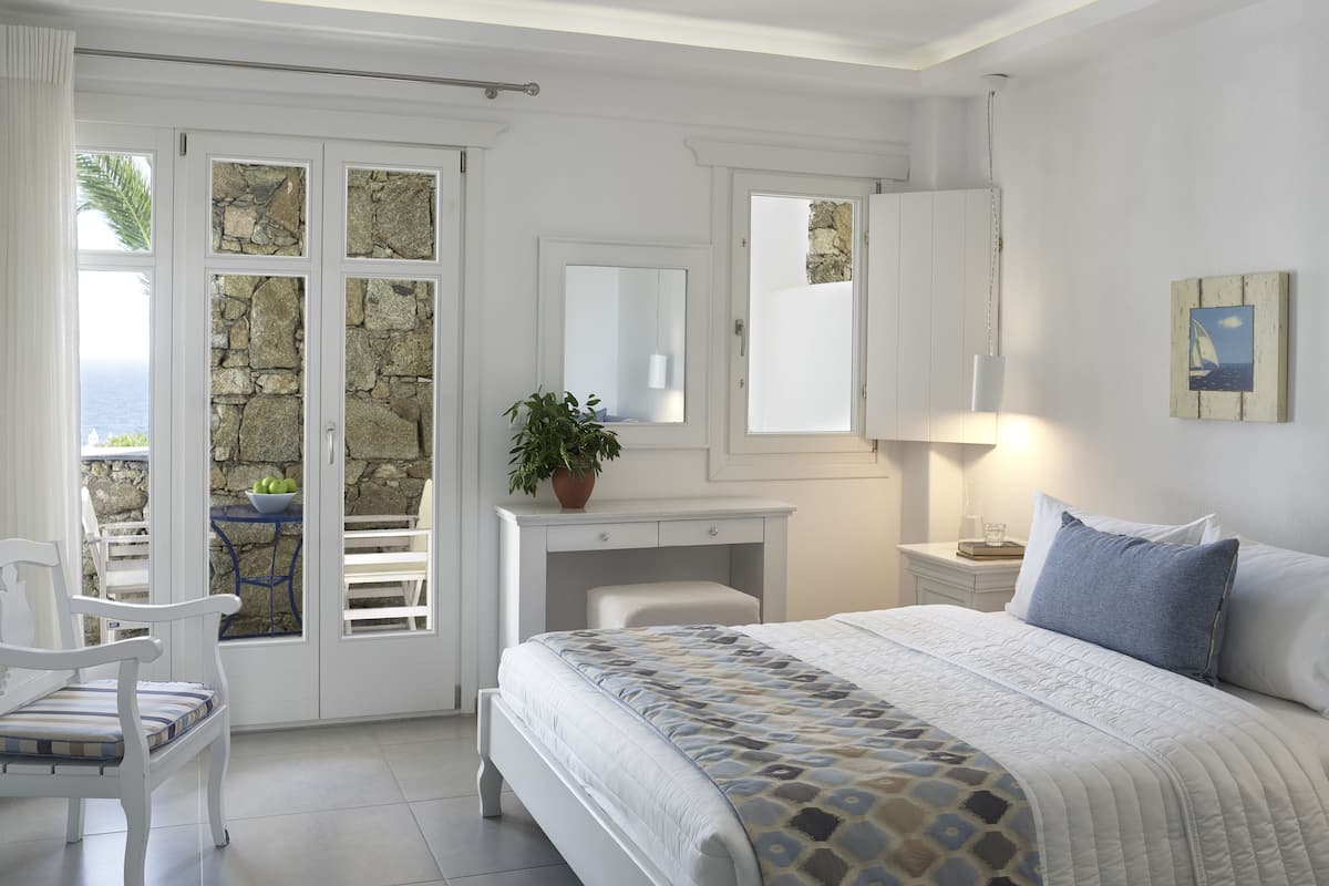 Deluxe Room | 1 bedroom, premium bedding, in-room safe, individually decorated