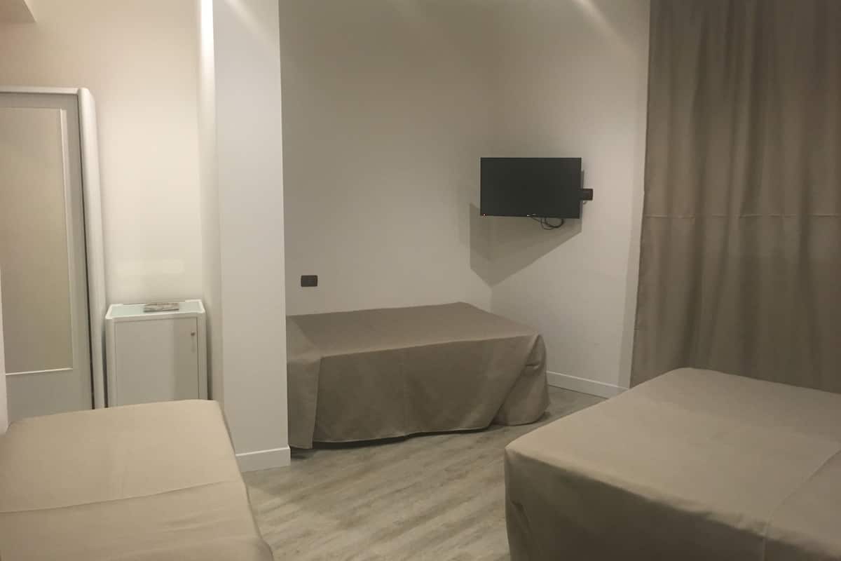 Standard Quadruple Room | Minibar, in-room safe, soundproofing, free cribs/infant beds