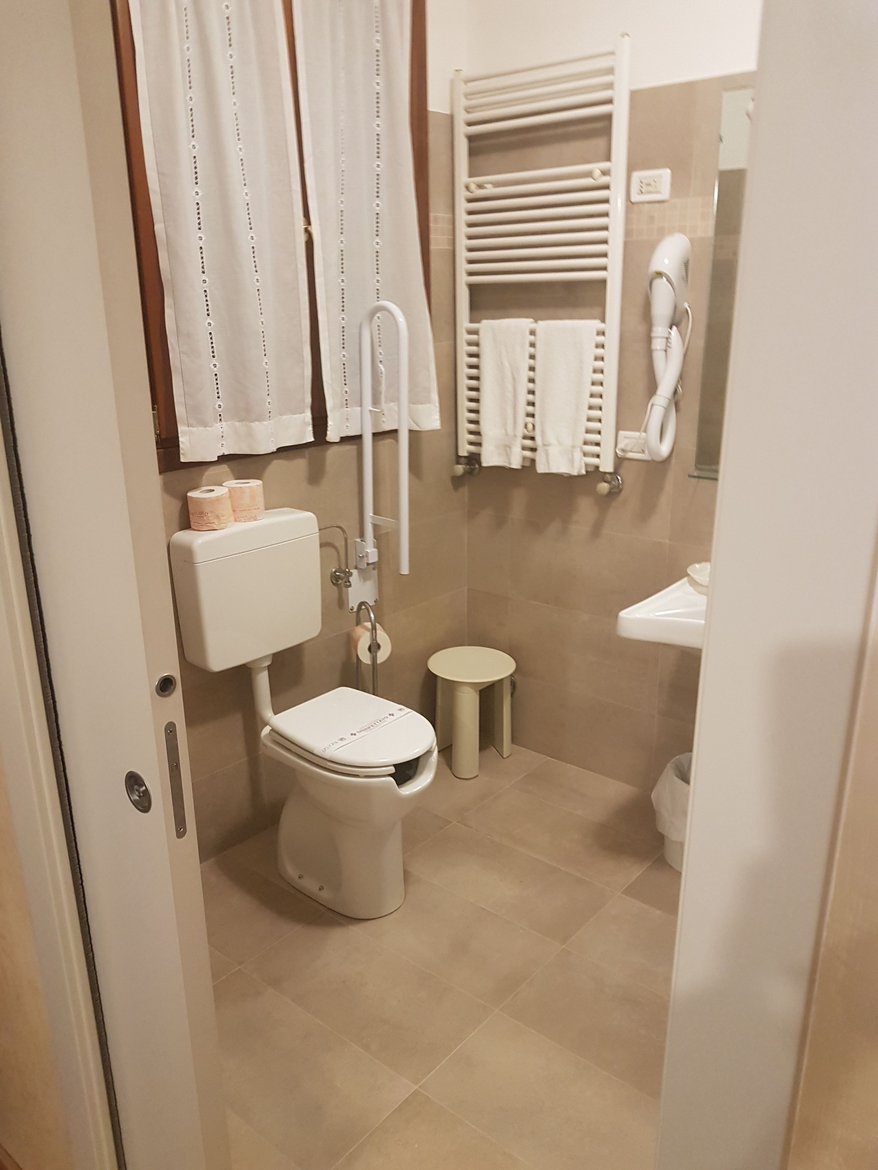 rainfall showerhead, hair dryer, towels, soap