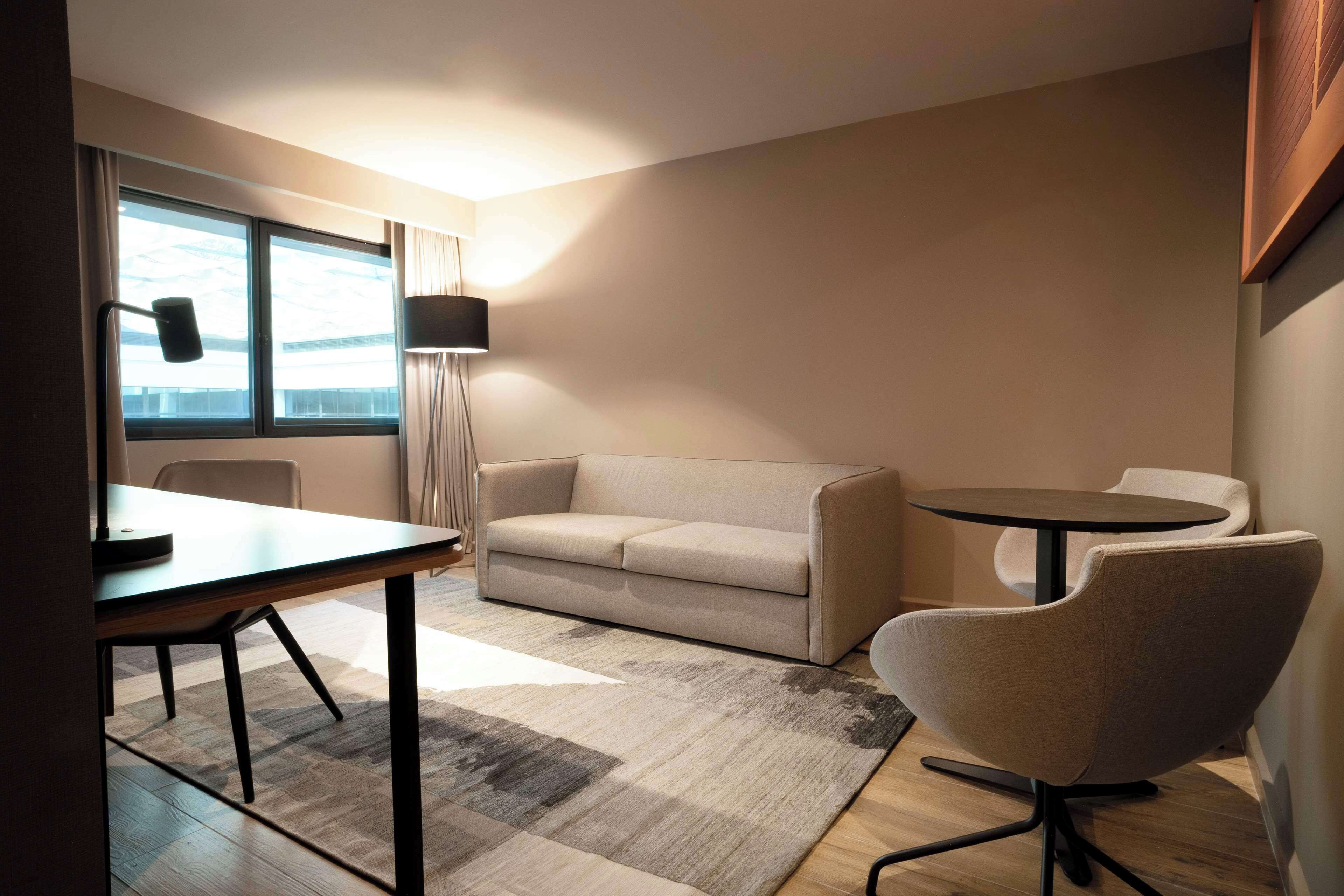 junior suite, 1 king bed | living area | 42-inch lcd tv with satellite channels, tv, mp3 dock