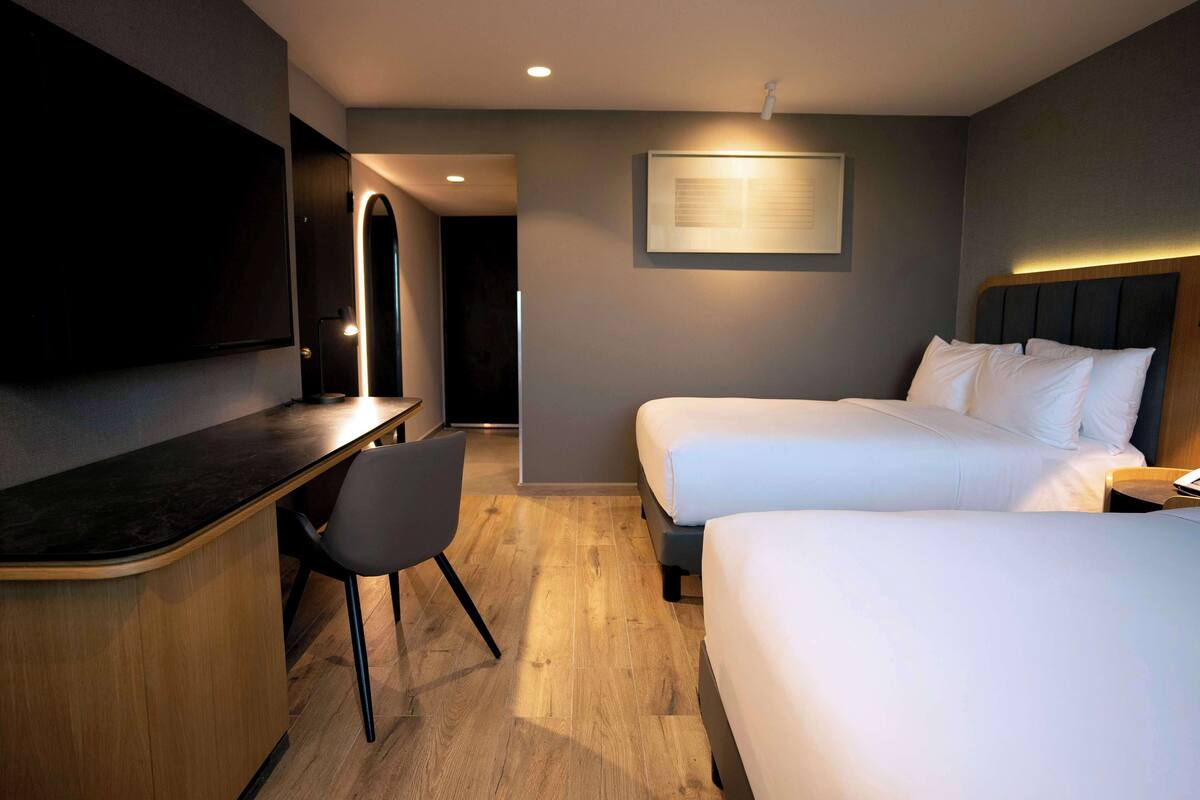 room, 2 double beds (airstrip view) | premium bedding, select comfort beds, in-room safe, desk