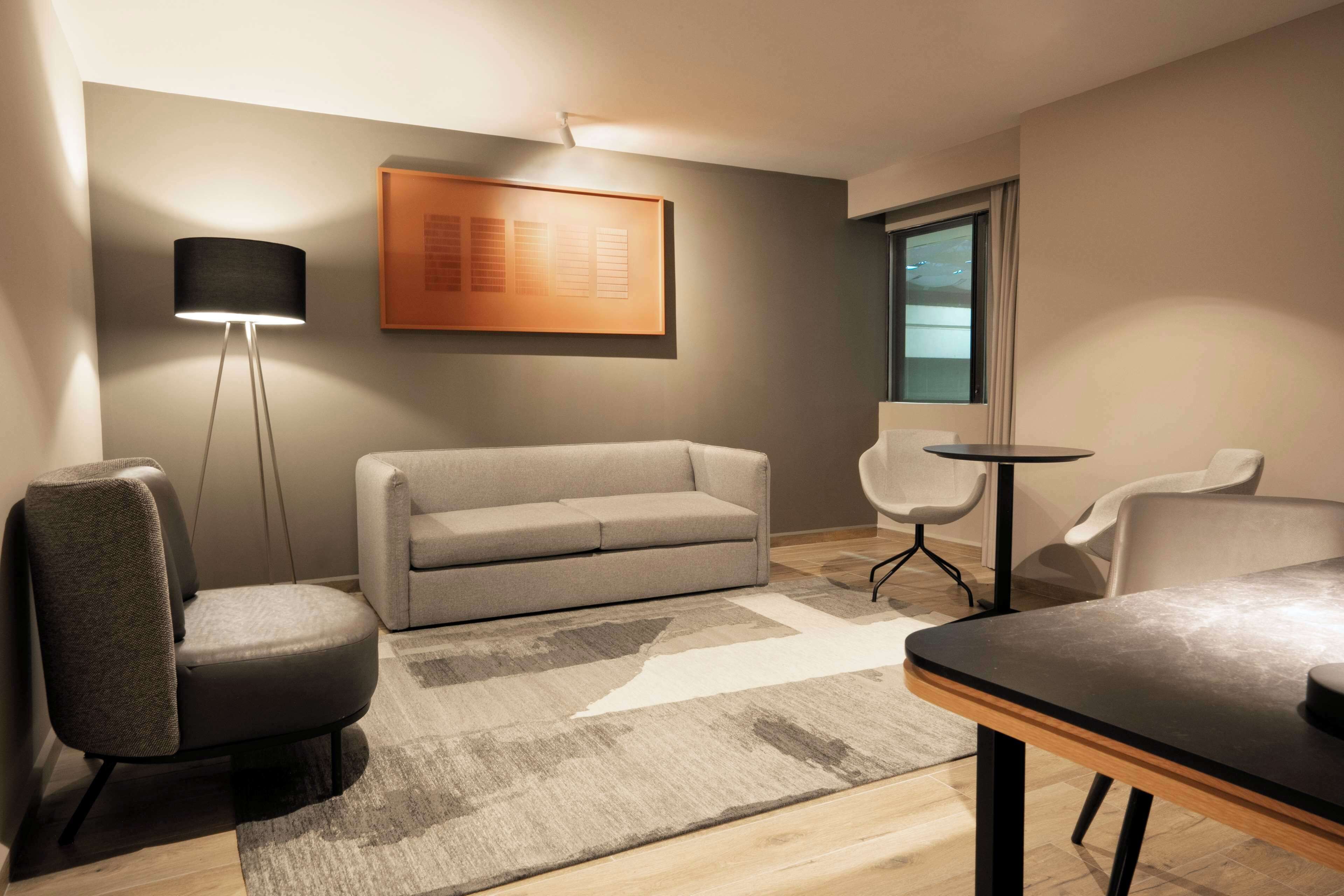 junior suite, 1 king bed | living area | 42-inch lcd tv with satellite channels, tv, mp3 dock