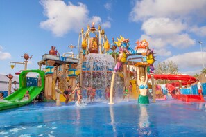 A water park with various water slides and play structures. - Sol Katmandu Park & Resort (Calvia)