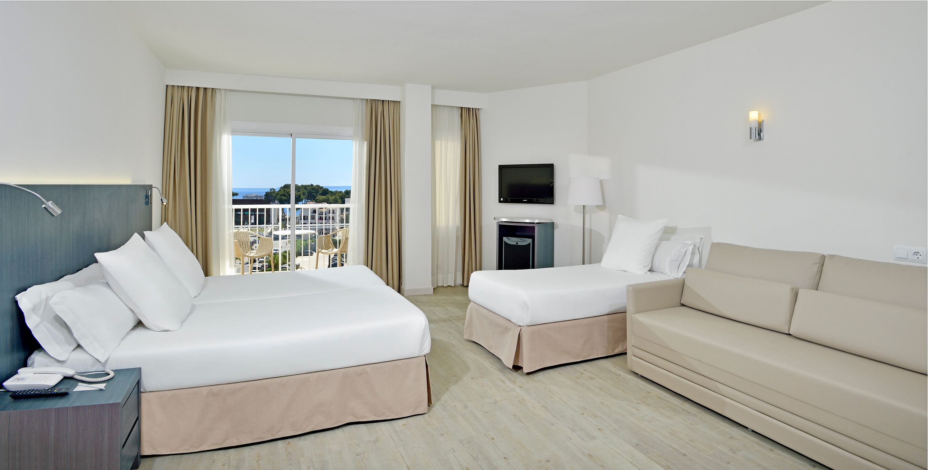 family room | 2 bedrooms, minibar, in-room safe, blackout curtains