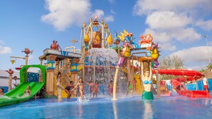 A water park with various water slides and play structures. - Sol Guadalupe (Calvia)