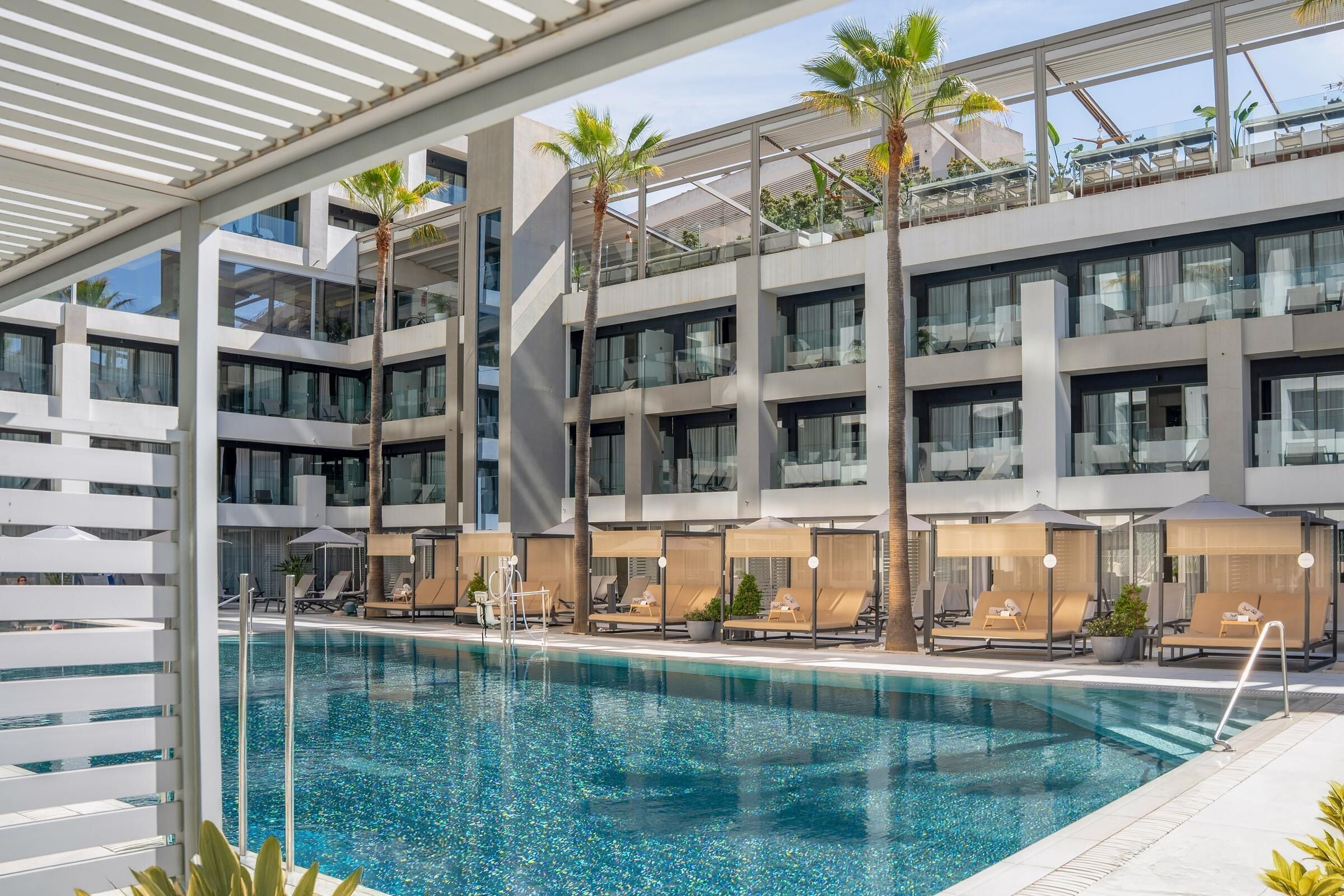 Outdoor pool, open 10:00 AM to 6:00 PM, pool umbrellas, pool loungers