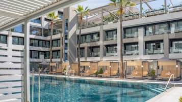 Outdoor pool, open 10:00 AM to 6:00 PM, pool umbrellas, pool loungers