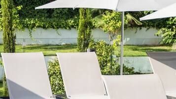 Outdoor pool, open 10:00 AM to 6:00 PM, pool umbrellas, sun loungers