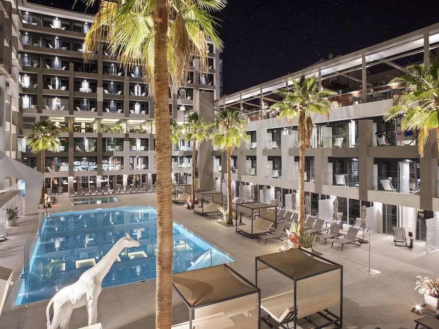 Outdoor pool, open 10:00 AM to 6:00 PM, pool umbrellas, pool loungers