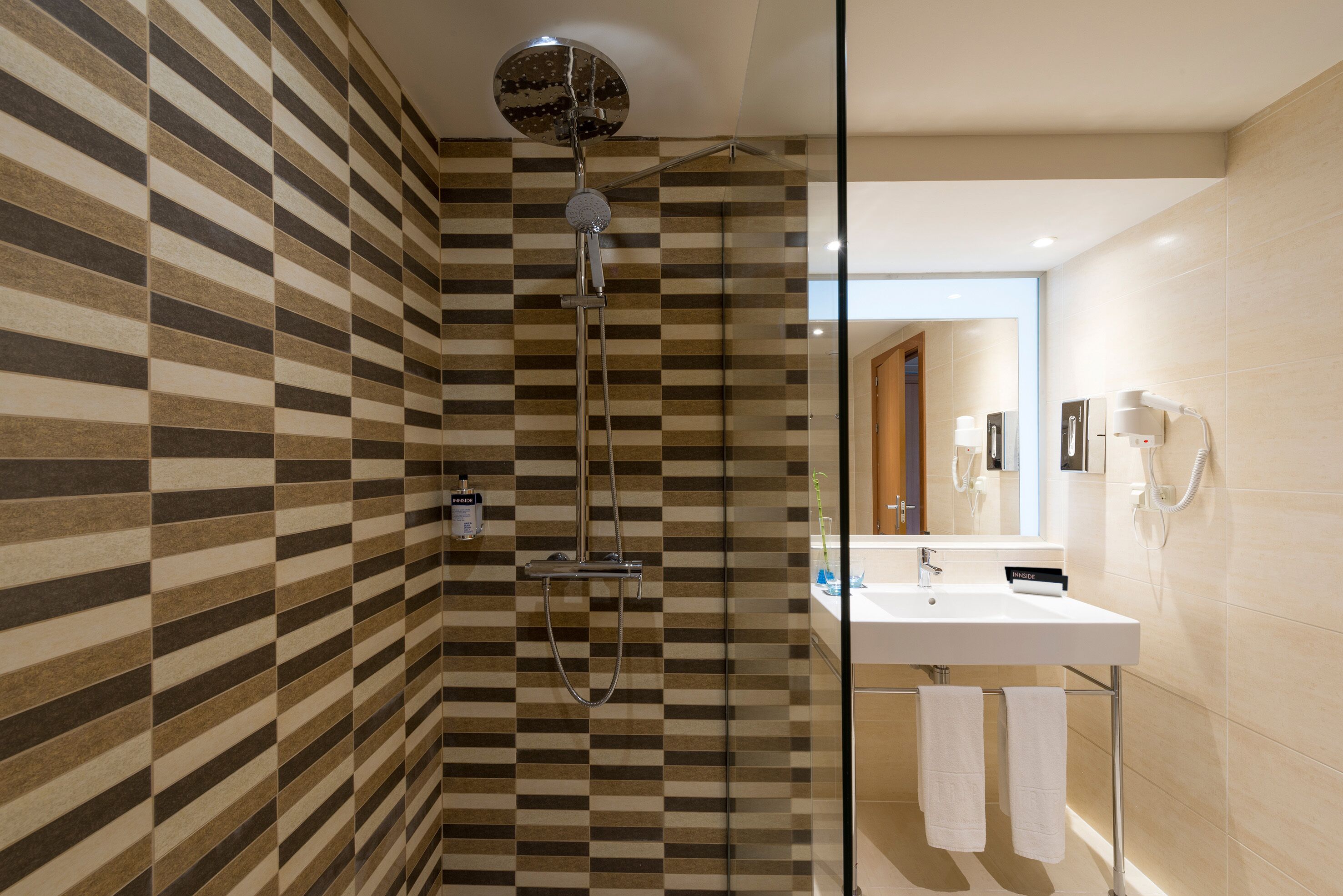 eco-friendly toiletries, hair dryer, towels, soap