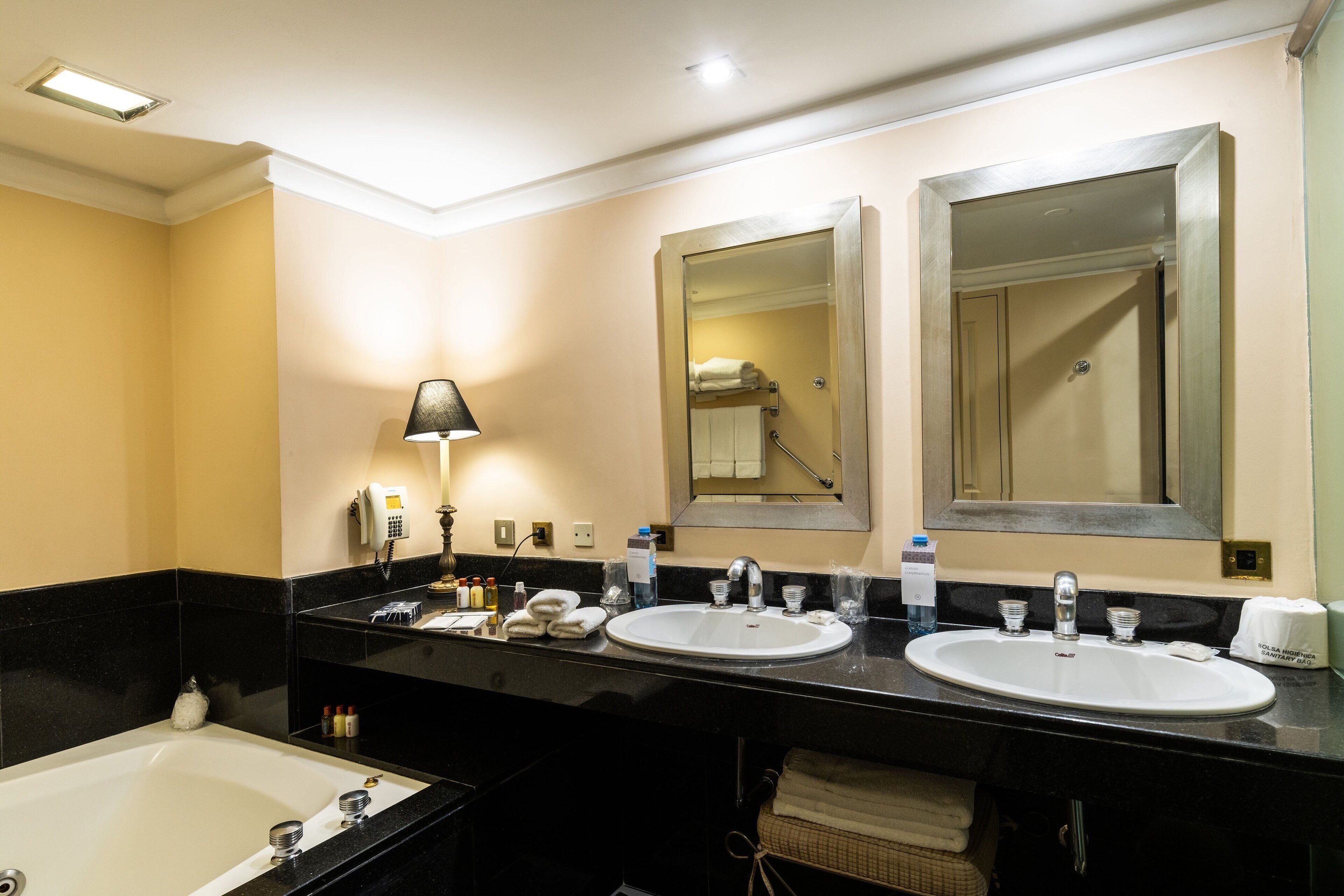 suite, 1 bedroom, city view | bathroom | combined shower/bathtub, deep-soaking bathtub, free toiletries