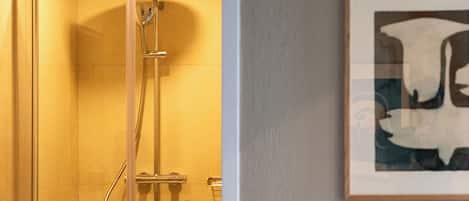 Shower, hair dryer, slippers, towels