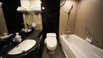 Un baño moderno con un lavabo negro, inodoro blanco y bañera blanca.