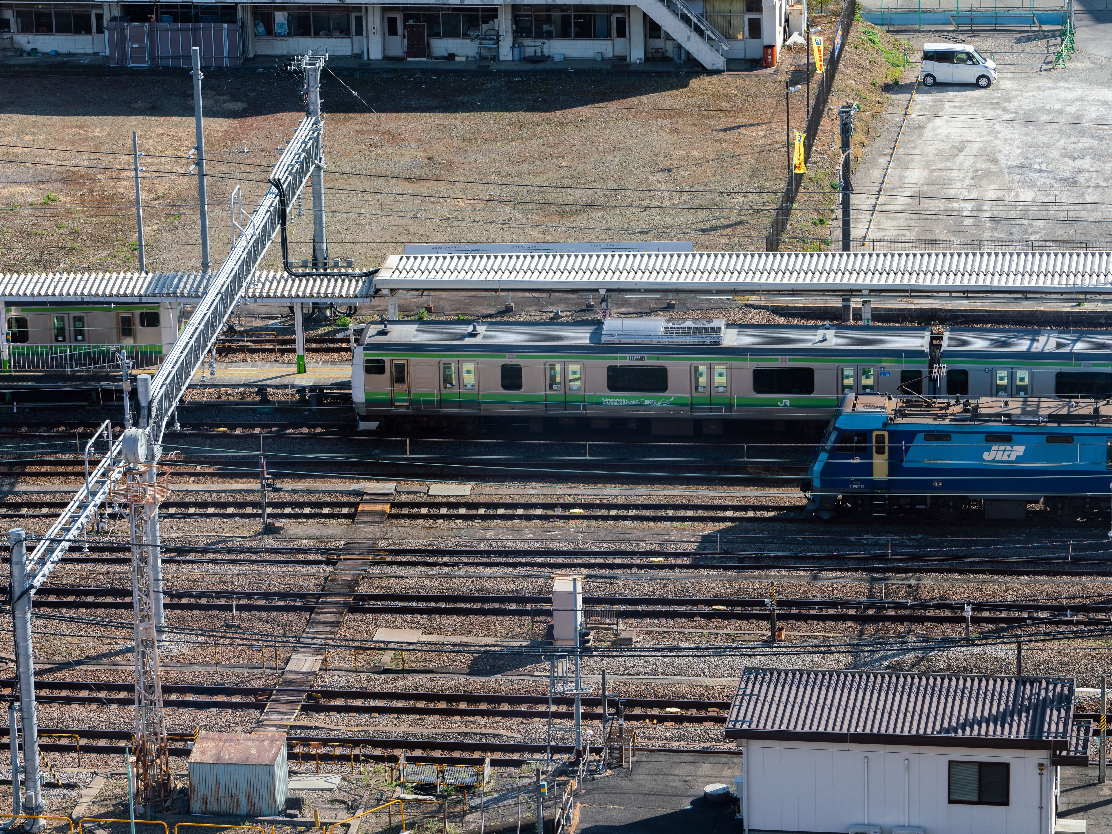 A train station with multiple tracks and a train platform.