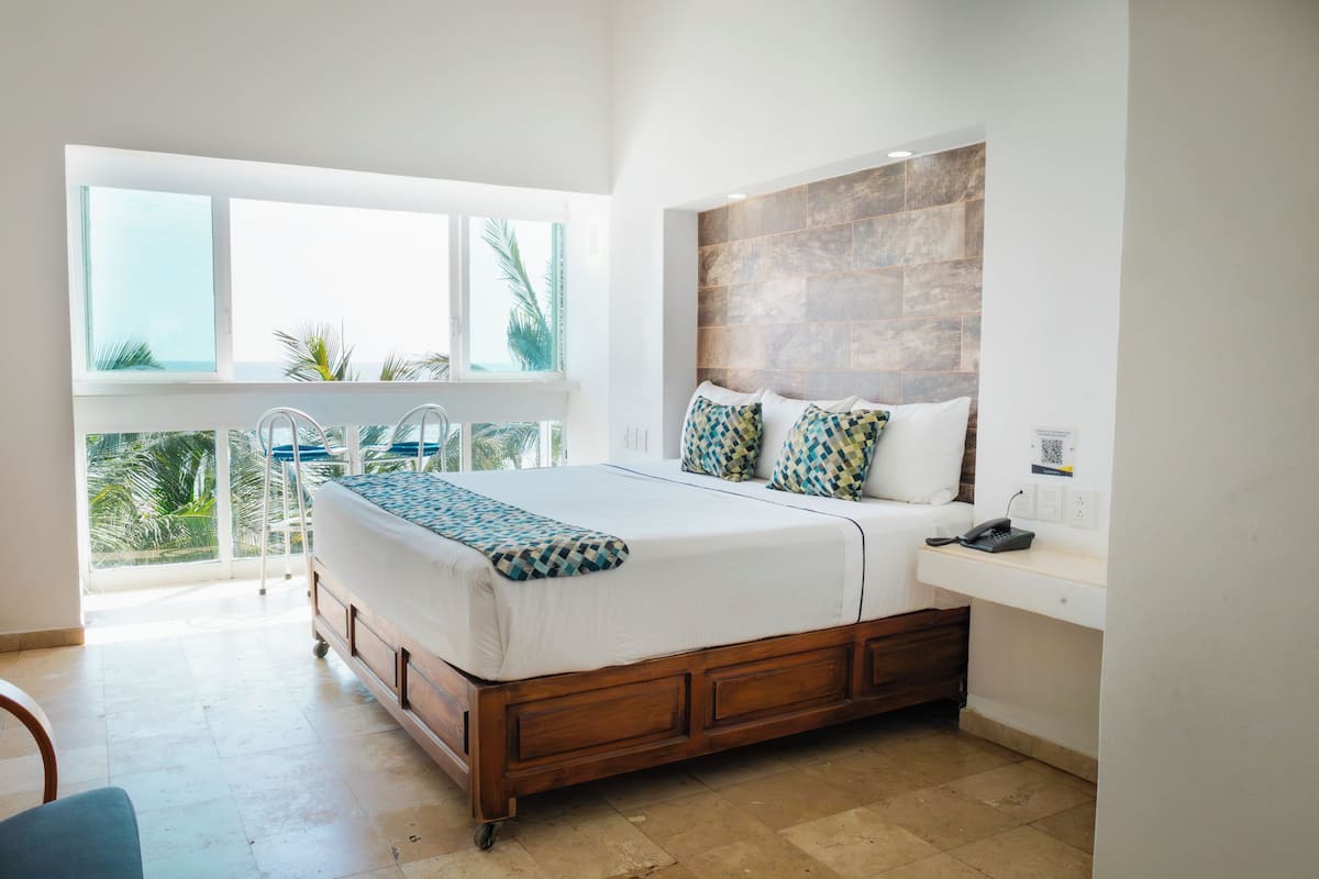 Superior Room, 1 King Bed, Sea View | 1 bedroom, in-room safe, laptop workspace, blackout drapes