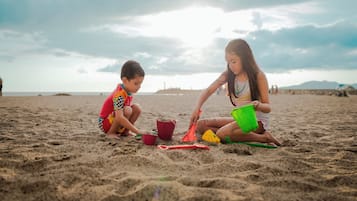On the beach, sun-loungers, beach umbrellas, beach towels