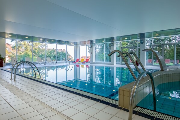 Indoor pool, open 8:00 AM to 9:00 PM, pool loungers