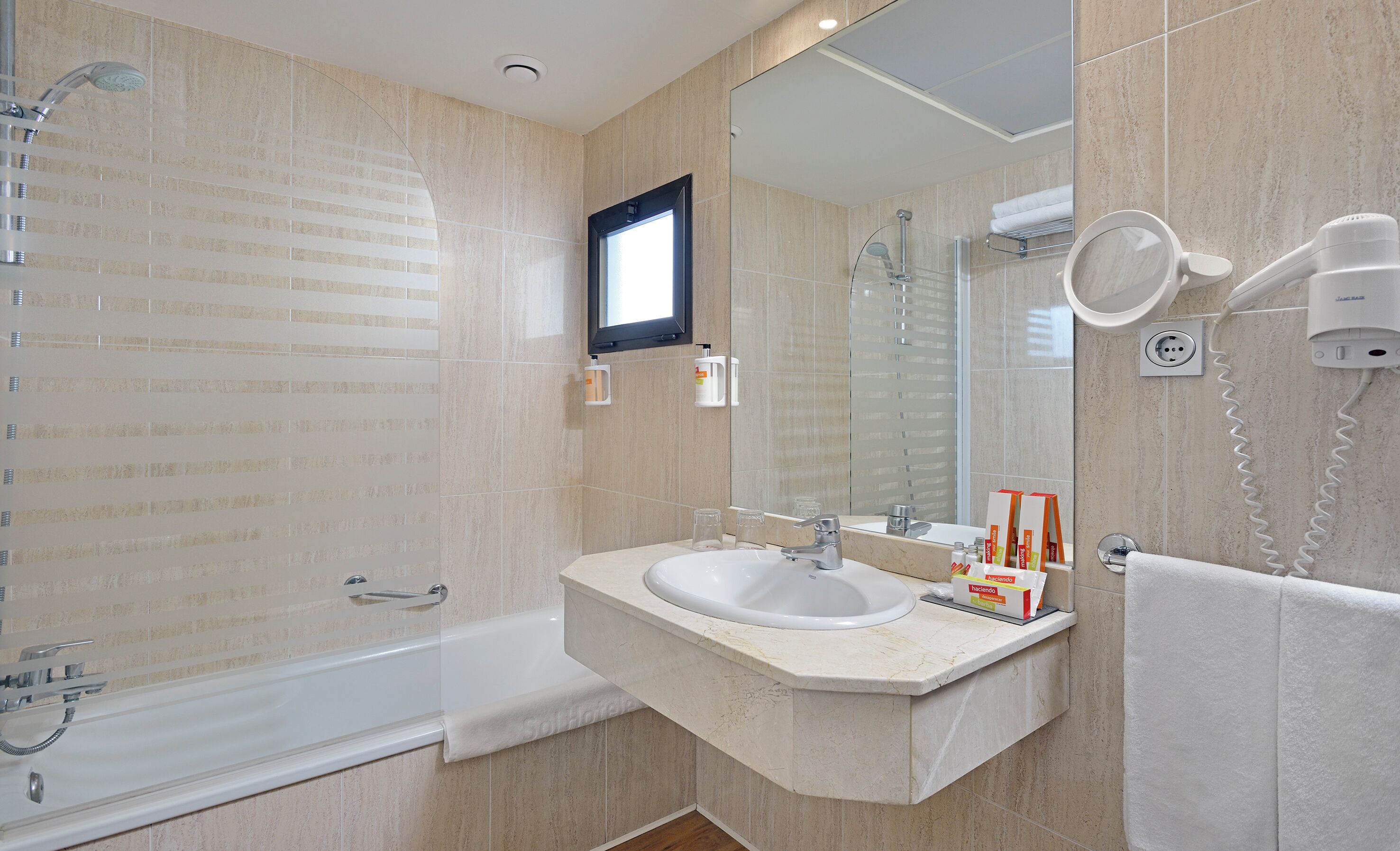 eco-friendly toiletries, hair dryer, towels, soap