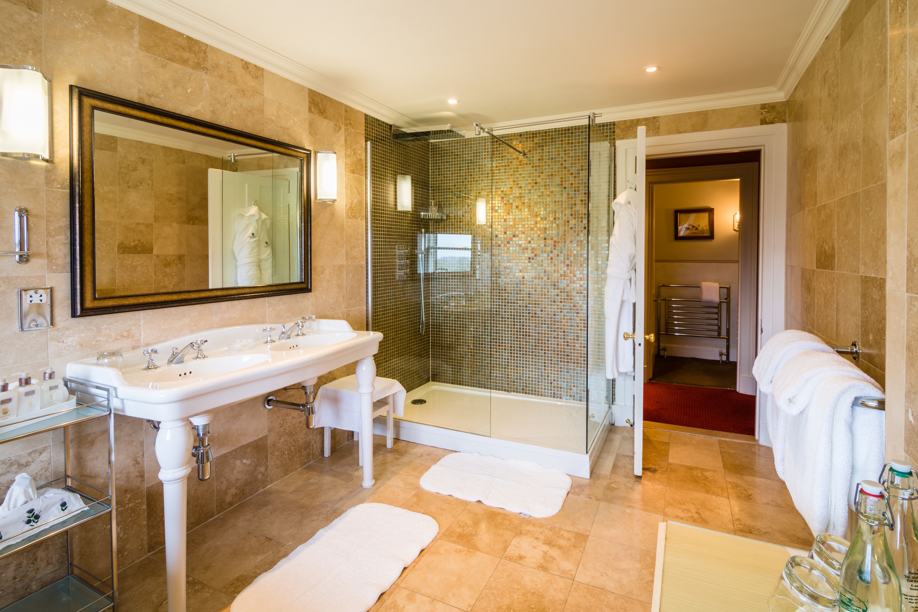 junior suite | bathroom | shower, free toiletries, hair dryer, bathrobes