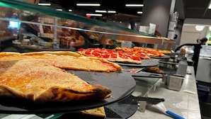 A pizza display with various types of pizzas in a restaurant. - Beaver Run Resort & Conference Center (Breckenridge)
