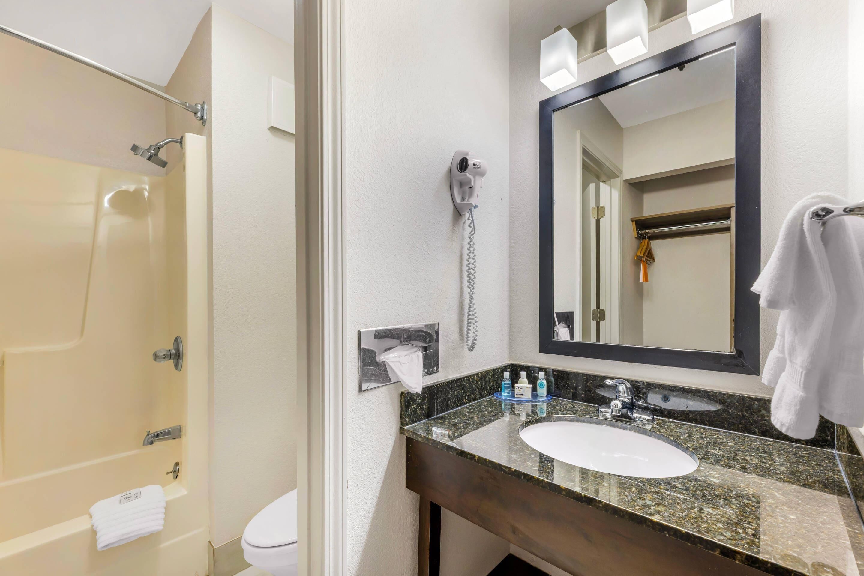 room, 2 queen beds | bathroom | free toiletries, hair dryer, towels