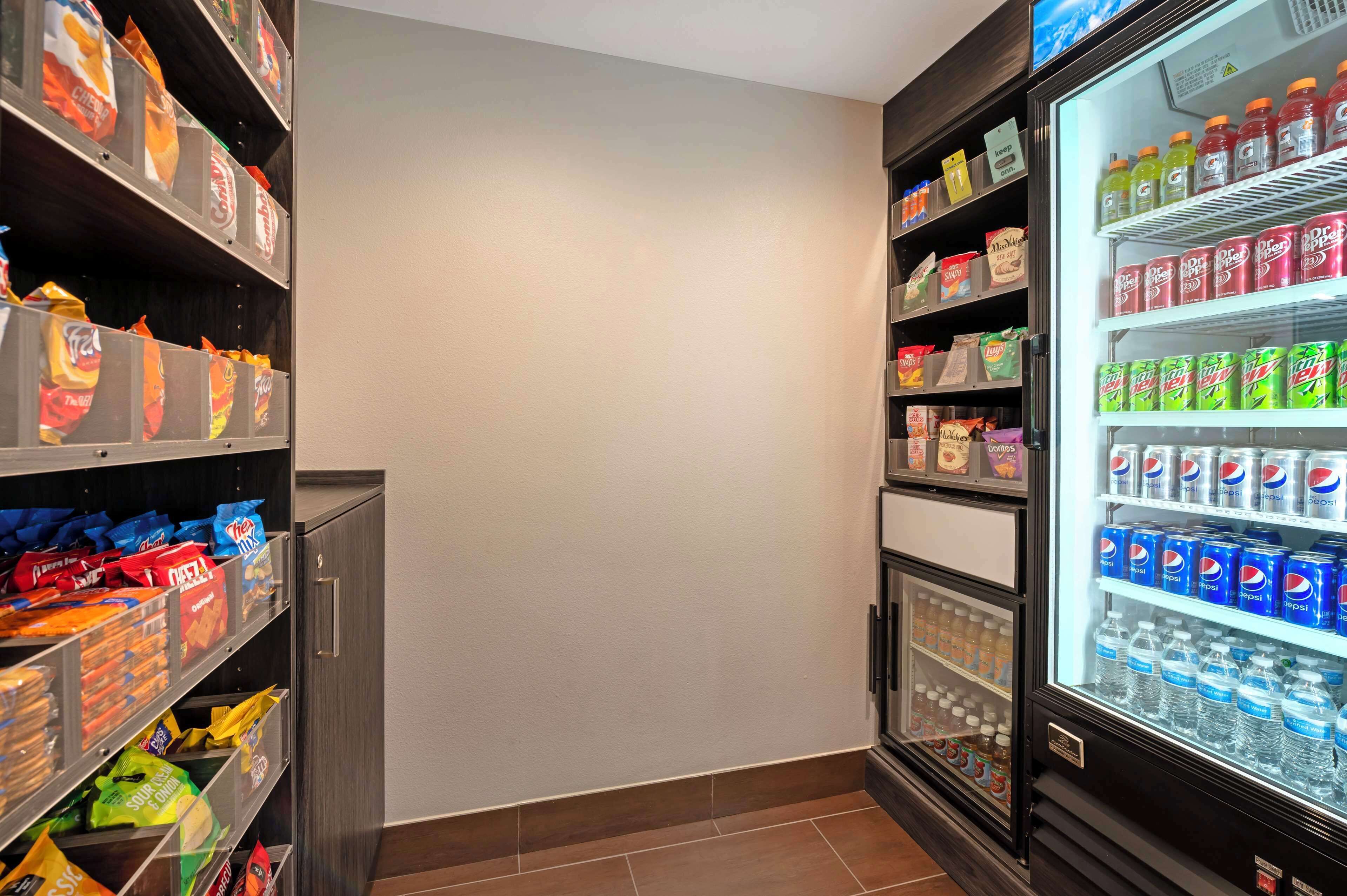 A vending machine area with snacks and drinks.