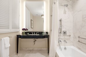 Designer toiletries, hair dryer, bathrobes, slippers
