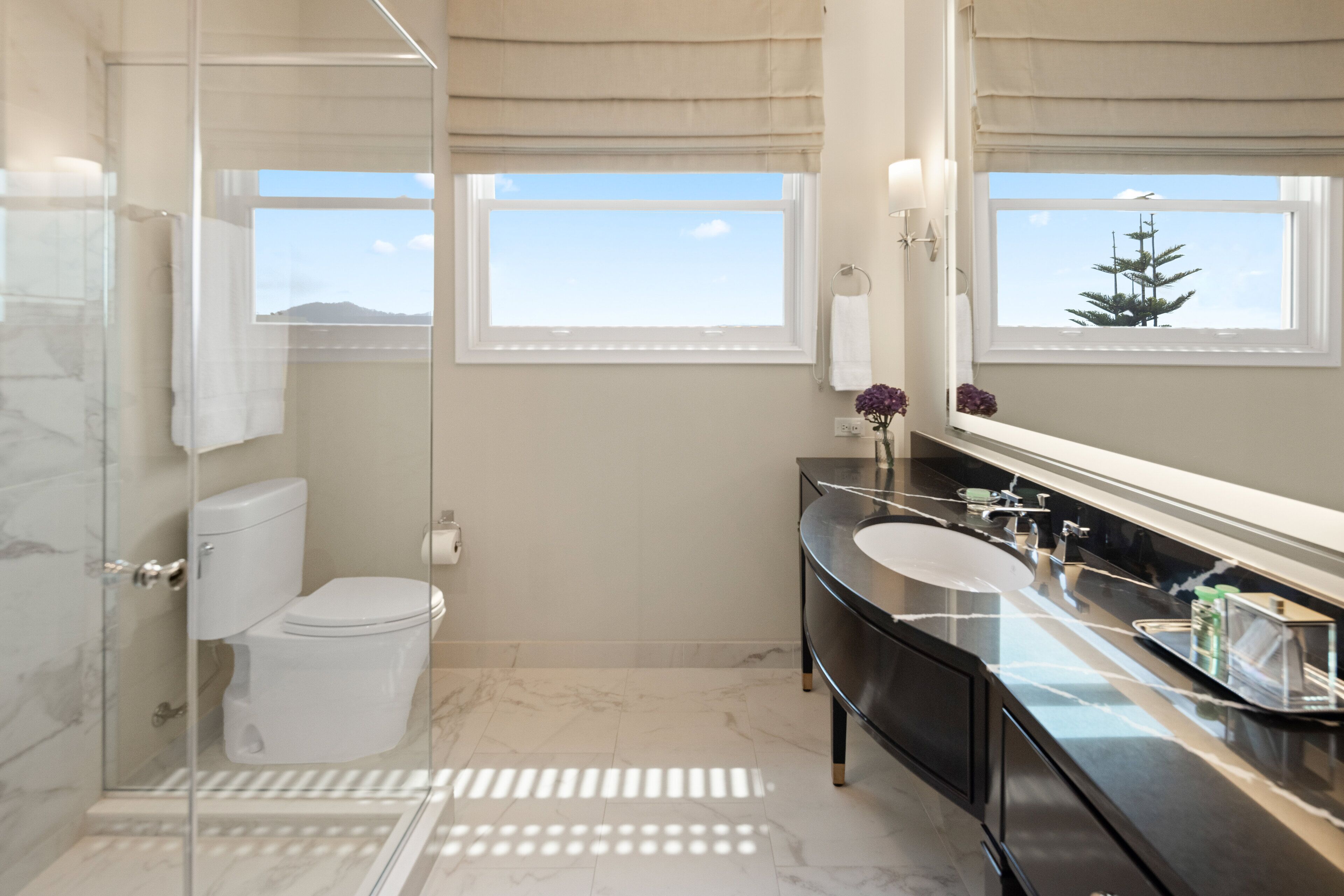 designer toiletries, hair dryer, bathrobes, slippers