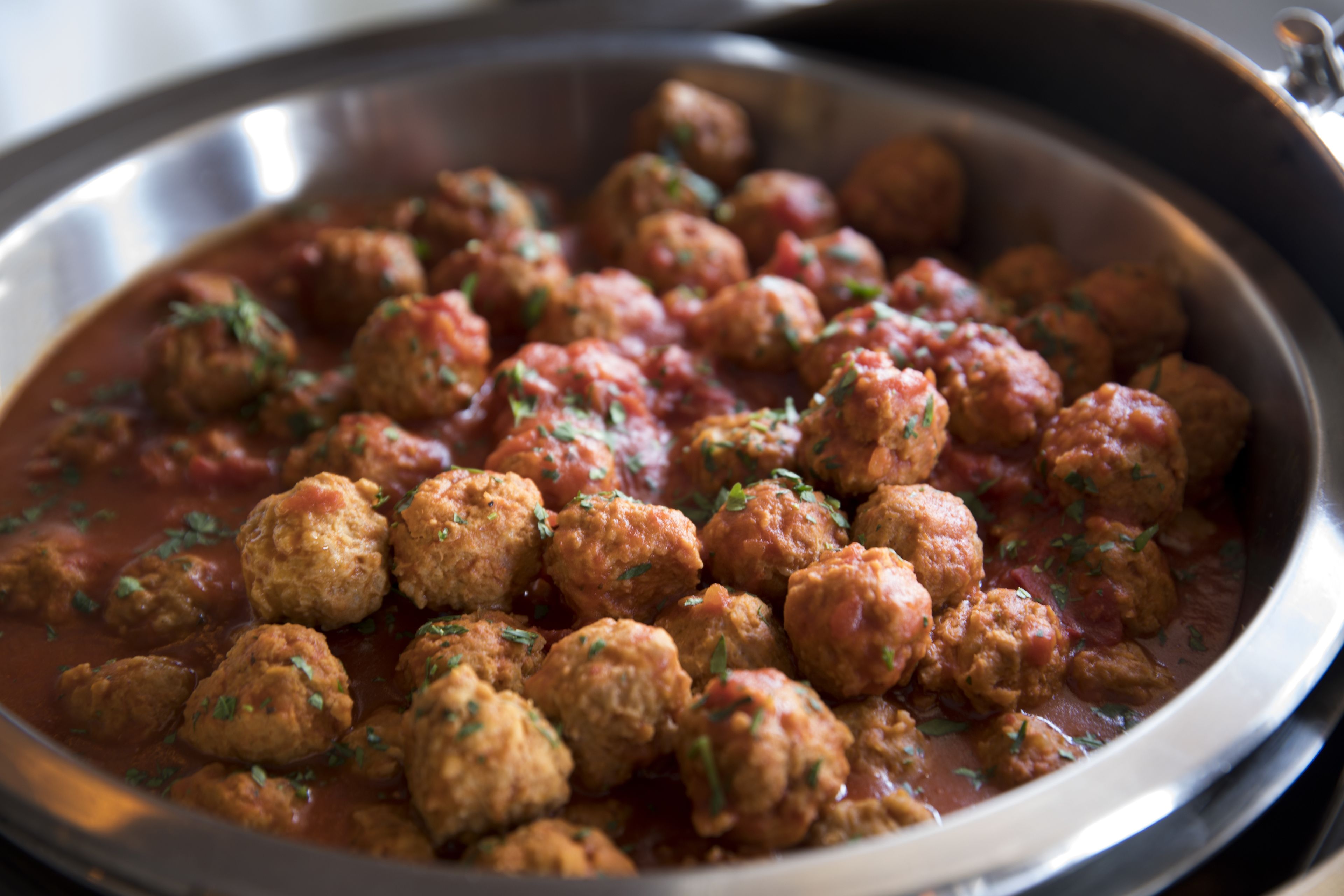 A pan filled with meatballs in tomato sauce.