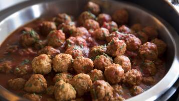 A pan filled with meatballs in tomato sauce.