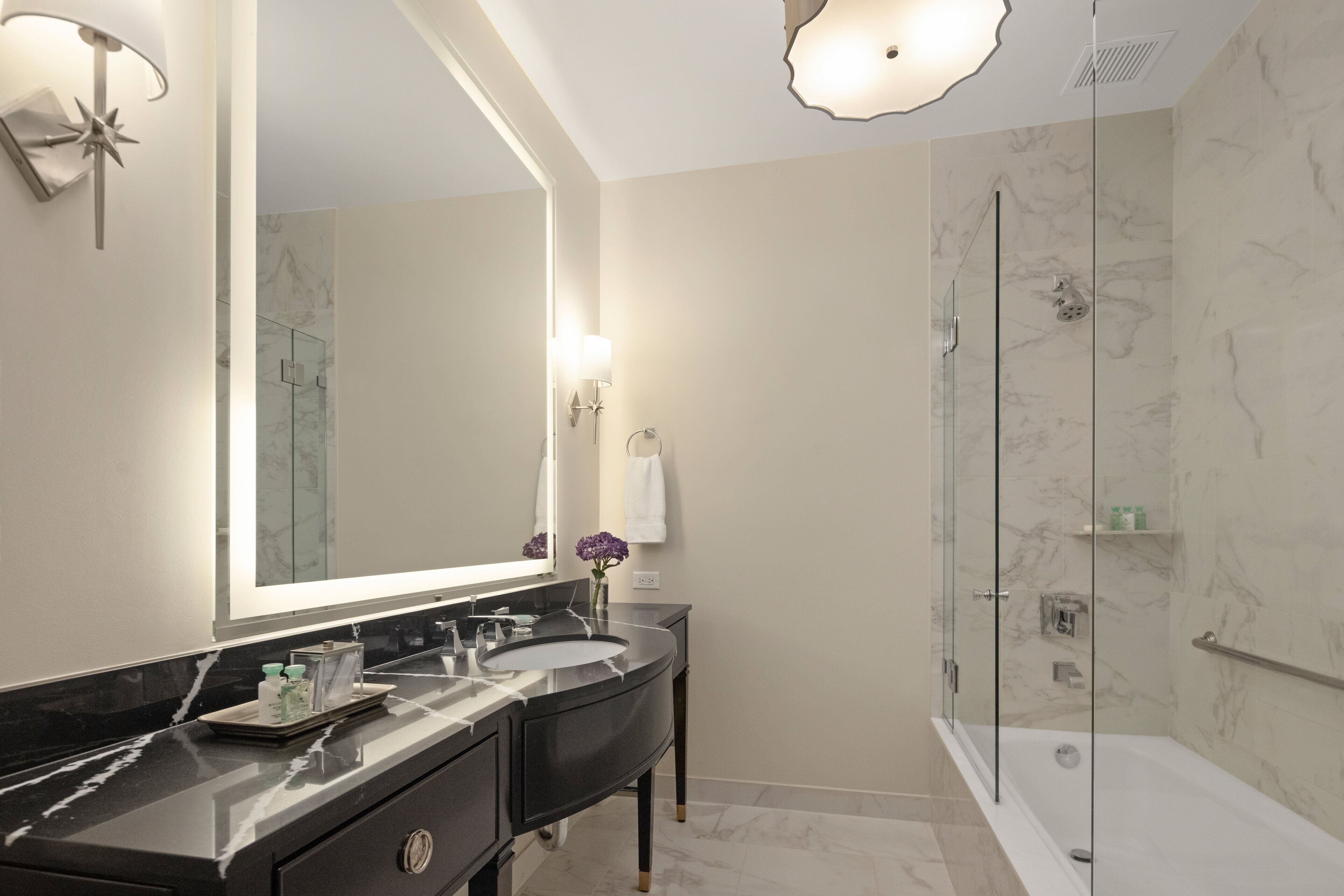 Designer toiletries, hair dryer, bathrobes, slippers