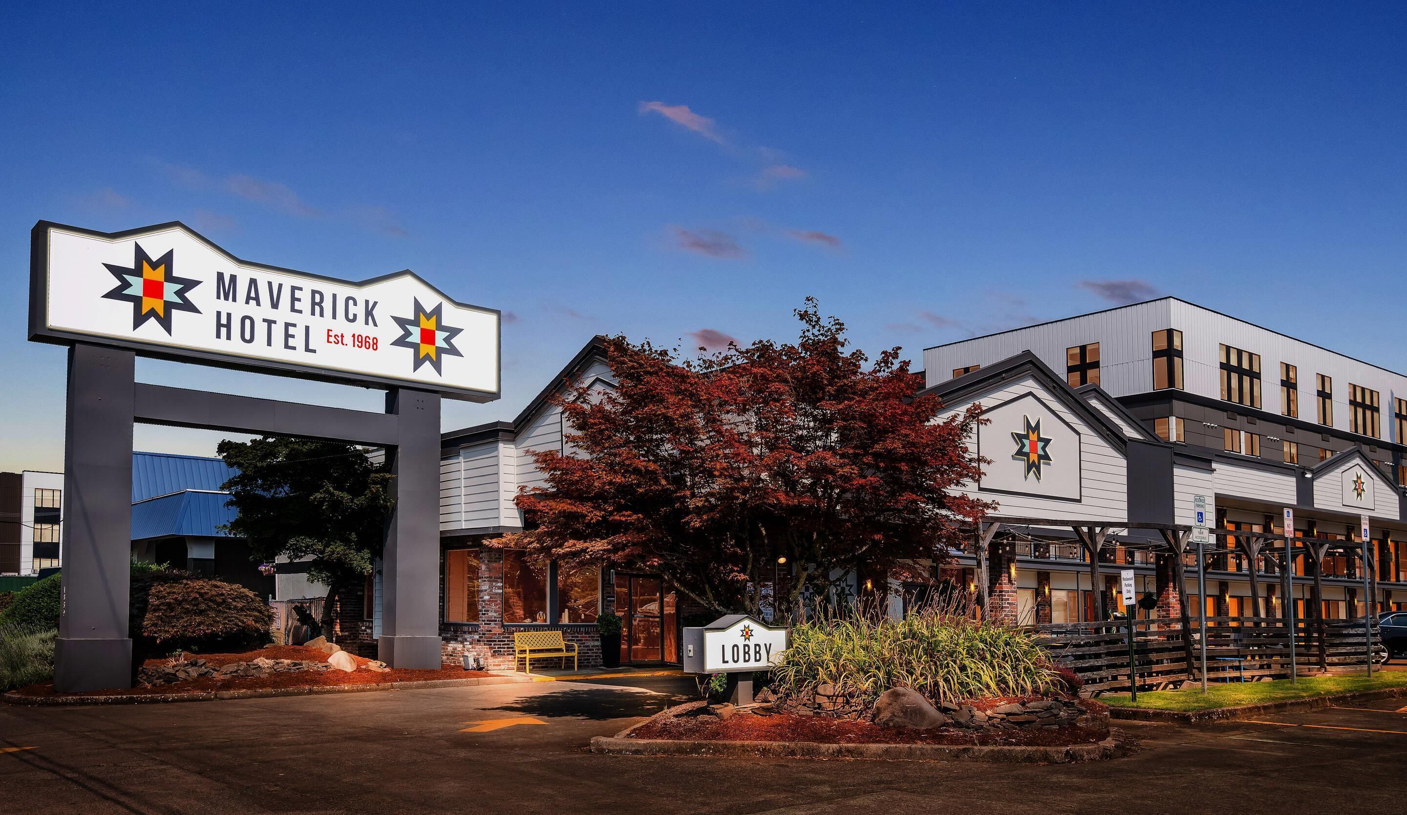 The Maverick Hotel with a prominent star logo, a lobby sign, and a modern building facade.