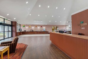 Welcome to our reception area, featuring a comfortable seating space and a convenient reception desk.