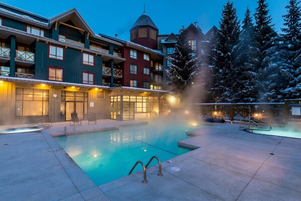 Outdoor pool, open 7:00 AM to 10:00 PM, pool umbrellas