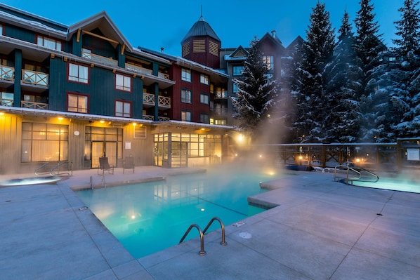 Outdoor pool, open 7:00 AM to 10:00 PM, pool umbrellas