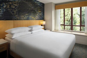 Camas con pillow-top, minibar y caja de seguridad en la habitación 