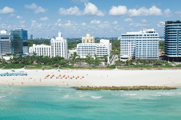 On the beach, sun-loungers, beach towels