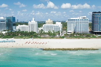 On the beach, sun loungers, beach towels at Hotel Riu Plaza Miami Beach