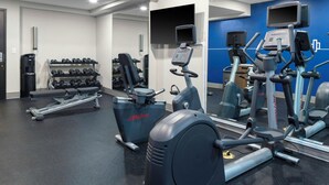A gym with various exercise equipment including treadmills, stationary bikes, and weight machines. - Holiday Inn Express & Suites Kimball by IHG (South Pittsburg)