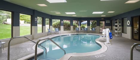 Indoor pool, open 9:00 AM to 11:00 PM, pool loungers