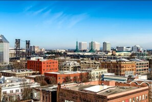 Panoramic city view with a mix of modern and historic architecture.