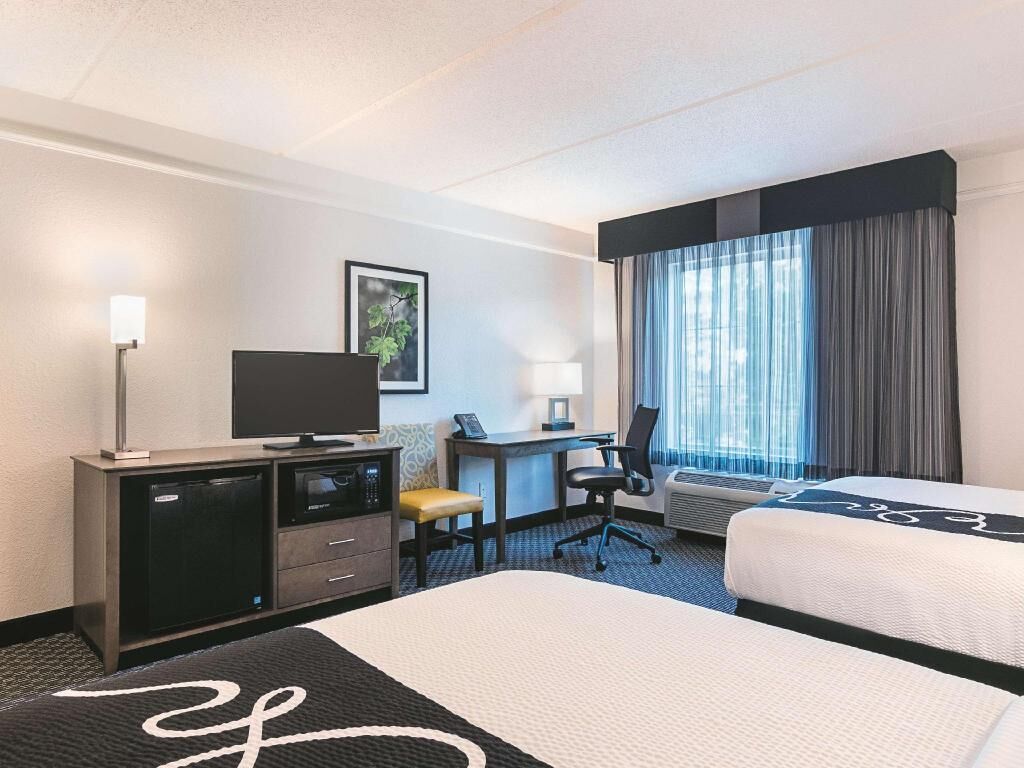 Premium bedding, desk, laptop workspace, iron/ironing board