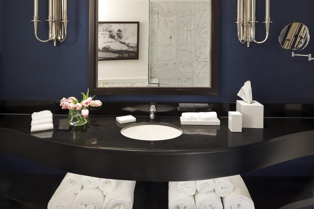 combined shower/bathtub, designer toiletries, hair dryer, bathrobes
