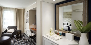 Frette Italian sheets, premium bedding, down comforters, minibar at Kimpton George Hotel, an IHG Hotel