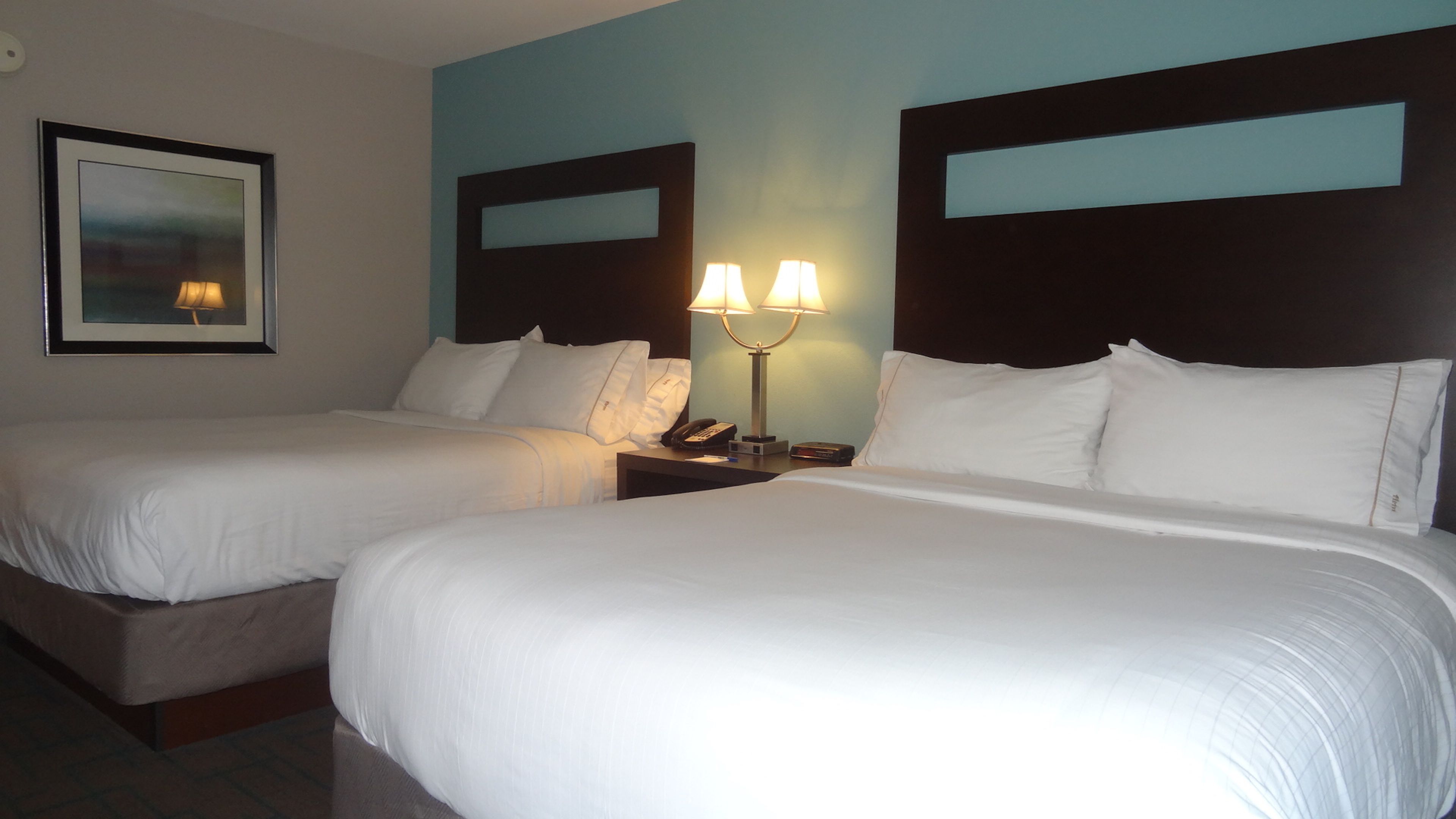 standard room, 2 queen beds | in-room safe, blackout curtains, iron/ironing board, travel cot