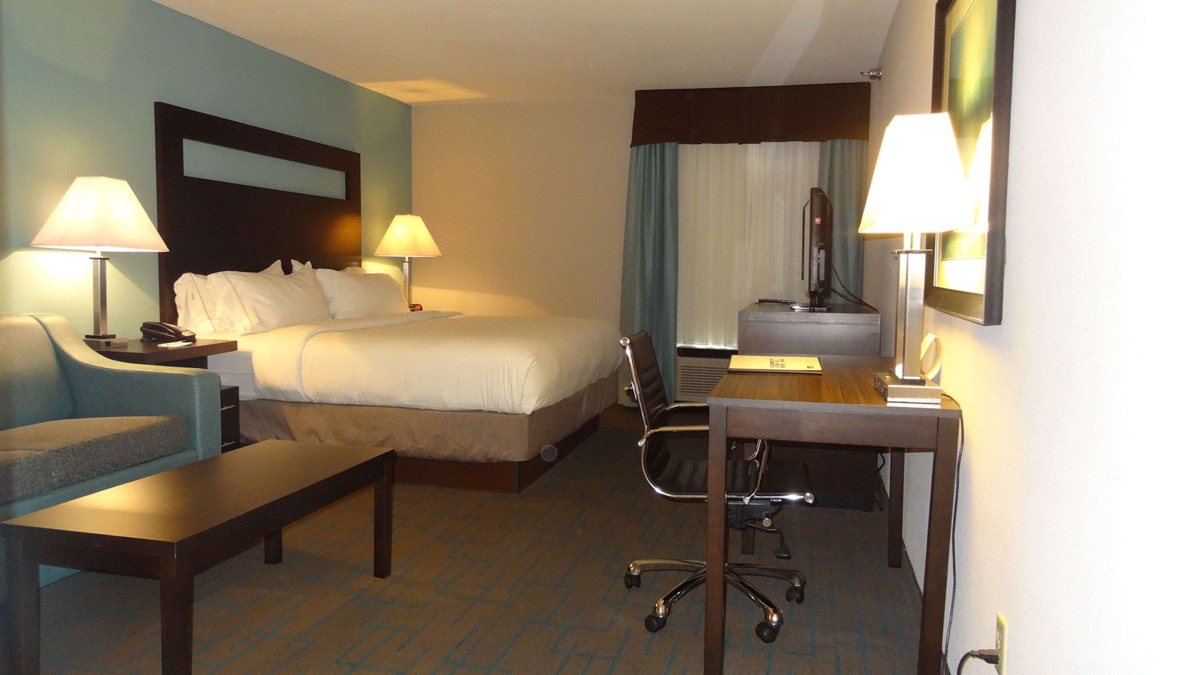 suite, 1 king bed (additional living area) | in-room safe, blackout curtains, iron/ironing board, travel cot