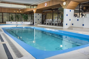 Indoor pool, open 6:00 AM to 11:00 PM, pool loungers