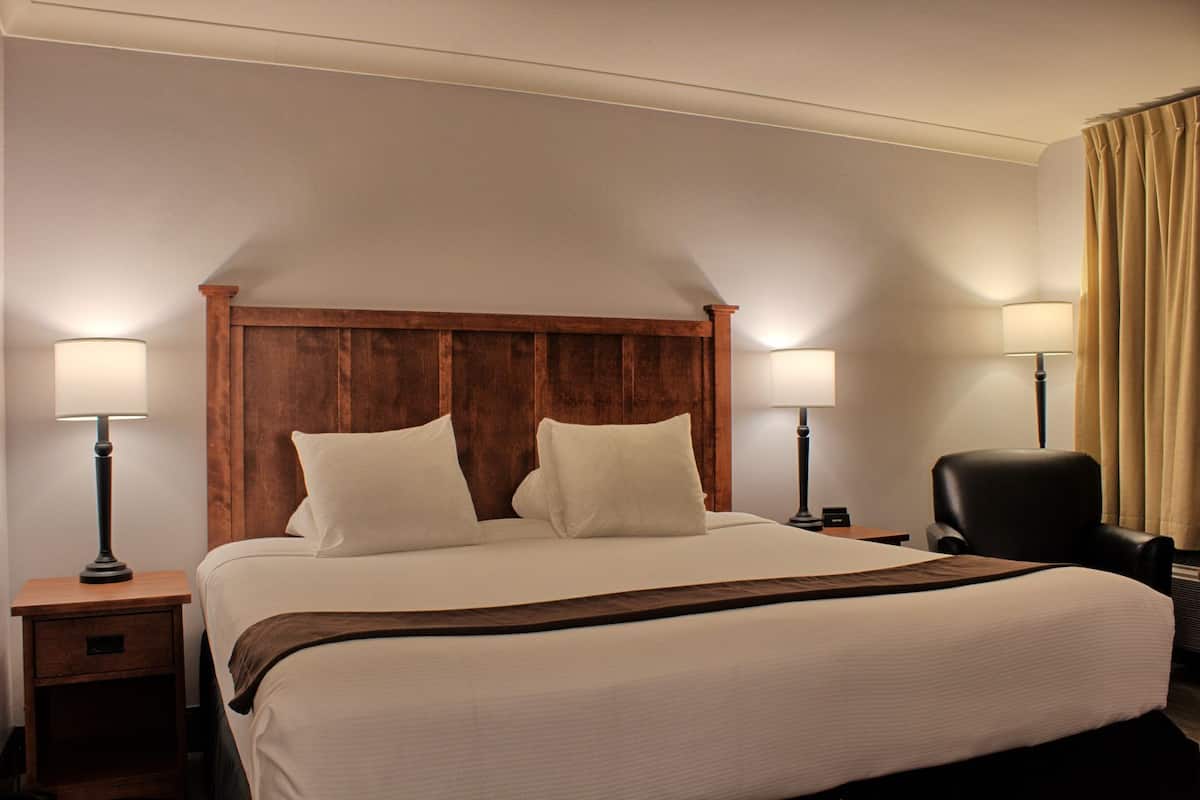 select plus king room | premium bedding, pillow-top beds, desk, blackout curtains