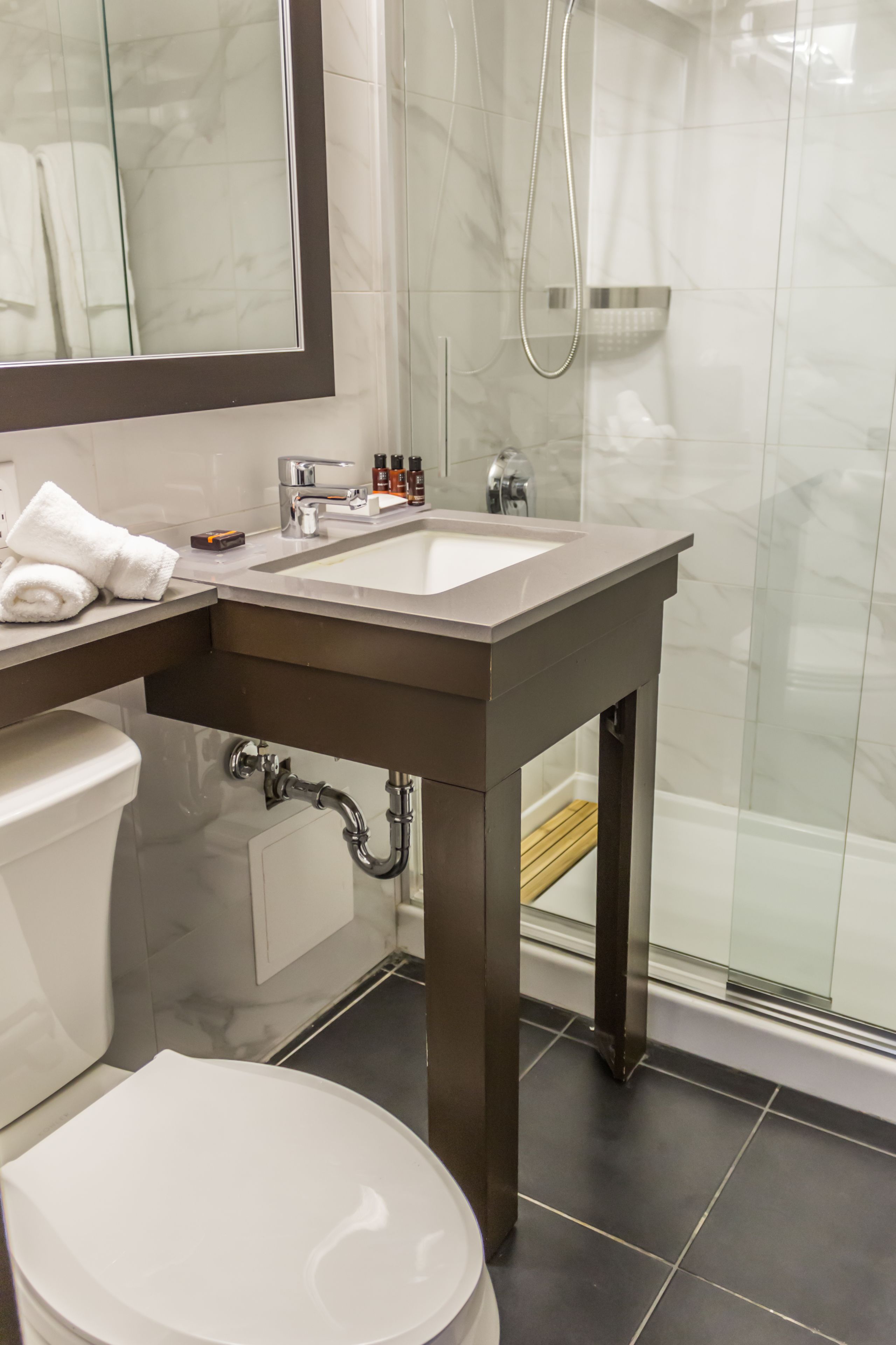 deluxe king room | bathroom | eco-friendly toiletries, hair dryer, towels